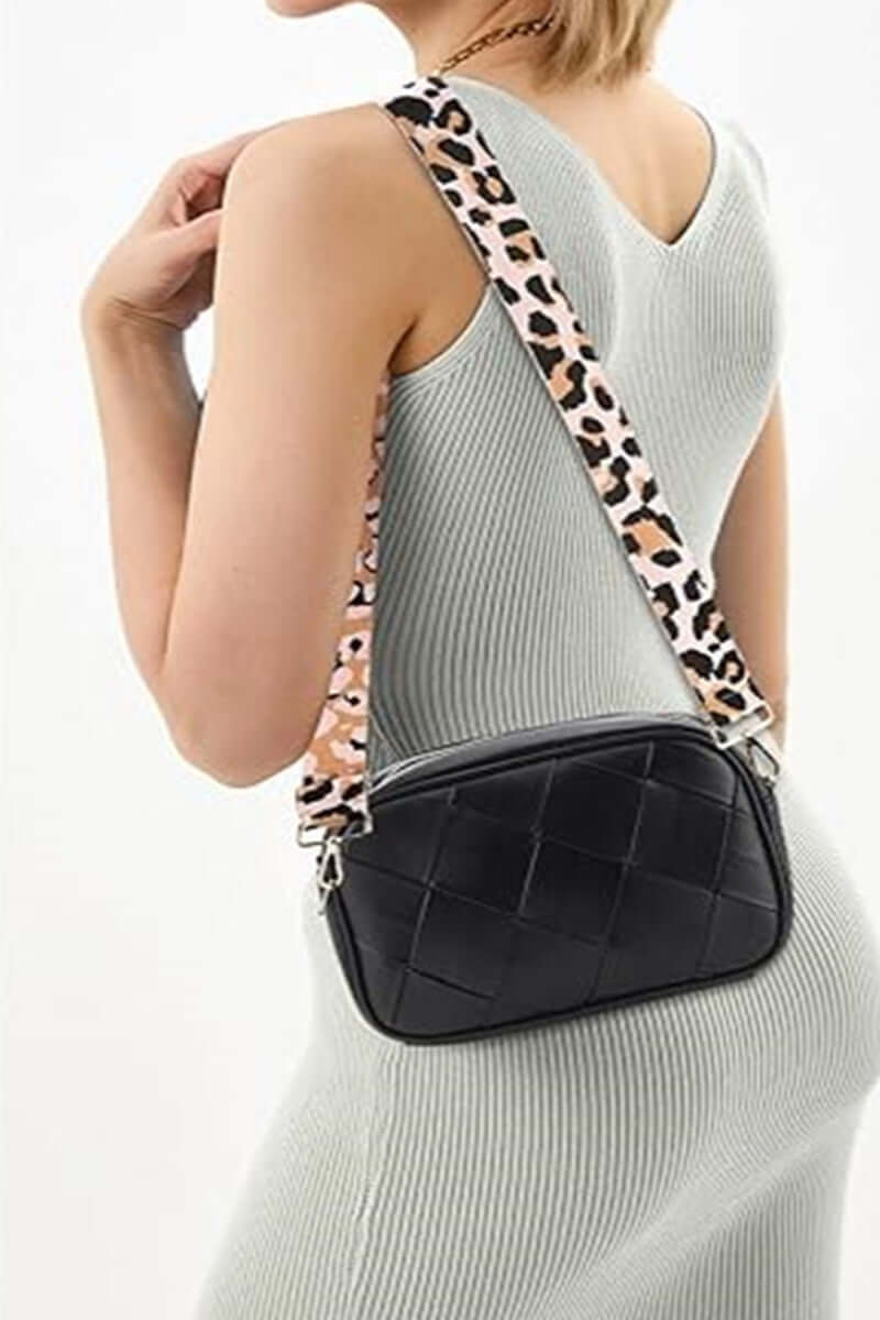 Stylish woman showcasing the Zenana Cassette Woven Crossbody Bag with a chic leopard strap. Perfect for hands-free fashion!