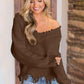 Woman wearing Bella Road Frayed Hem Dropped Shoulder Sweater, stylish and playful look, perfect for casual outings.