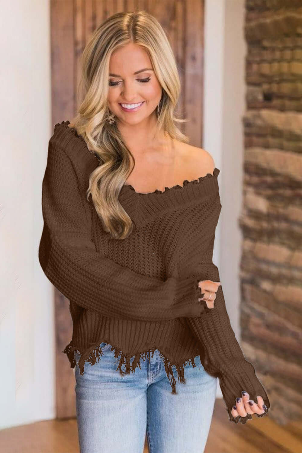 Woman wearing Bella Road Frayed Hem Dropped Shoulder Sweater, stylish and playful look, perfect for casual outings.