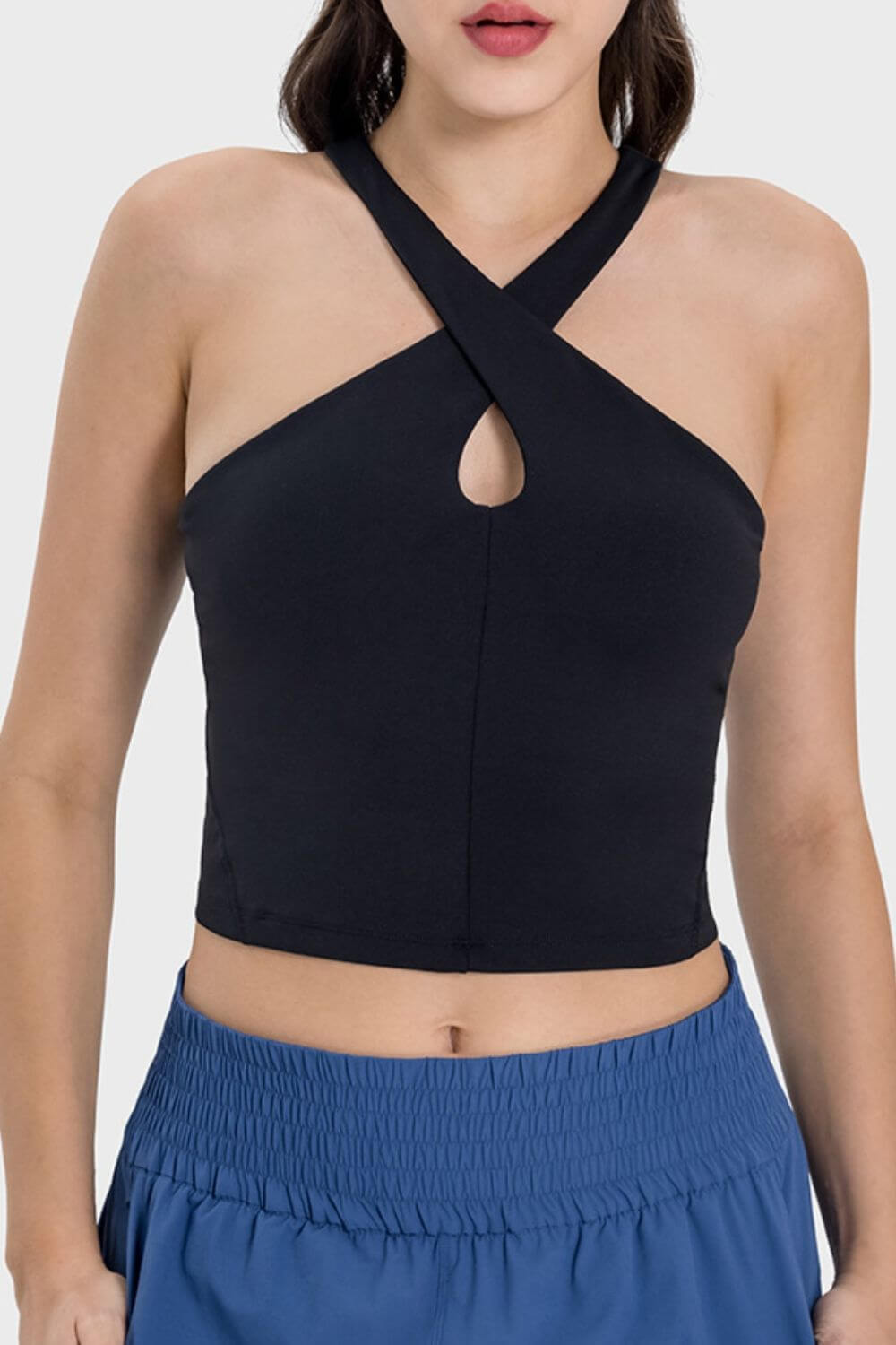 Millennia Crisscross Grecian Neck Active Cami in black, showcasing a stylish cut and unique neckline perfect for workouts.