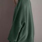 Woman wearing cozy green double take side slit round neck long sleeve sweater with moderate stretch