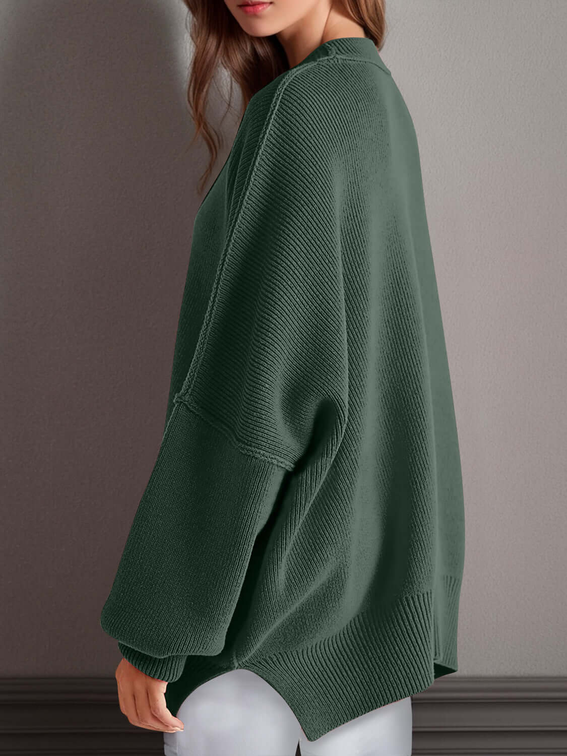 Woman wearing cozy green double take side slit round neck long sleeve sweater with moderate stretch