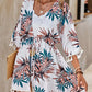 Model in Bella Road Swim Tassel Tied Printed Half Sleeve Cover Up with floral design and tassel trim, ideal for beachwear.