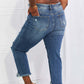 Back view of person wearing Risen Jeans Undone Chic Straight Leg Jeans, showcasing distressed details, raw hem, and cropped length.