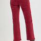 High rise straight jeans with patch pockets in deep red, showcasing a classic yet modern look with black boots.