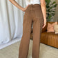 High-rise garment dye wide leg jeans with relaxed fit in brown, back view, worn by woman for stylish and flattering look