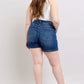 Back view of a plus size model wearing Judy Blue double button denim shorts, showcasing high-waisted style and comfort.