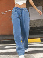 Woman wearing Bella Road Wide Leg Jeans with Pockets, low waist, buttoned and slightly stretchy, in blue denim cotton blend.