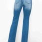 Back view of bytos full size distressed high rise jeans with pockets, showcasing their stylish faded blue wash.