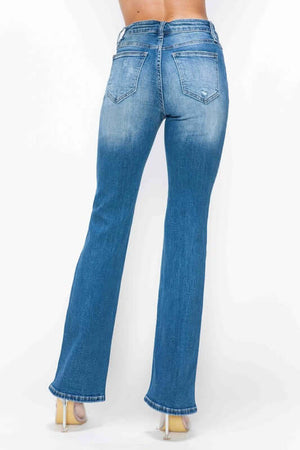 Back view of bytos full size distressed high rise jeans with pockets, showcasing their stylish faded blue wash.