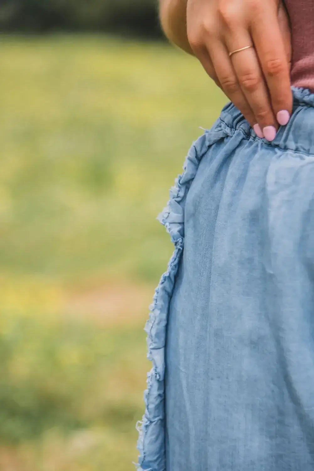 Close-up of Bella Road Raw Hem Wide Leg Jeans showcasing unique raw hem and detailing.