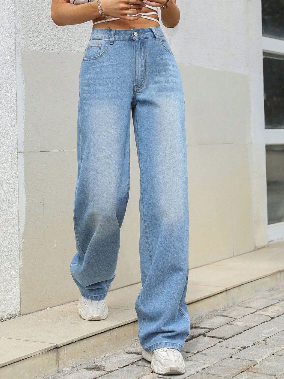 Stylish Bella Road Denim Mid Rise Wide Leg Jeans in light blue, perfect for a trendy and comfortable look.