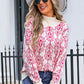 Stylish woman in Angel Wings Flower Turtleneck Sweater, smiling outdoors in a chic hat and sunglasses.