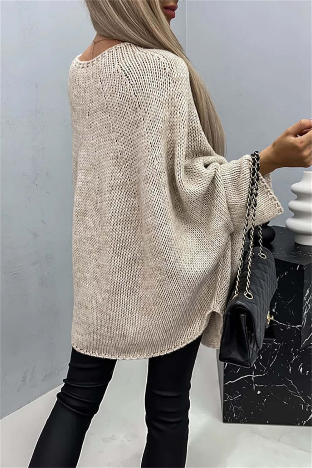 Woman wearing Bella Road Round Neck Batwing Sleeve Sweater with stylish batwing sleeves and a cozy fit.