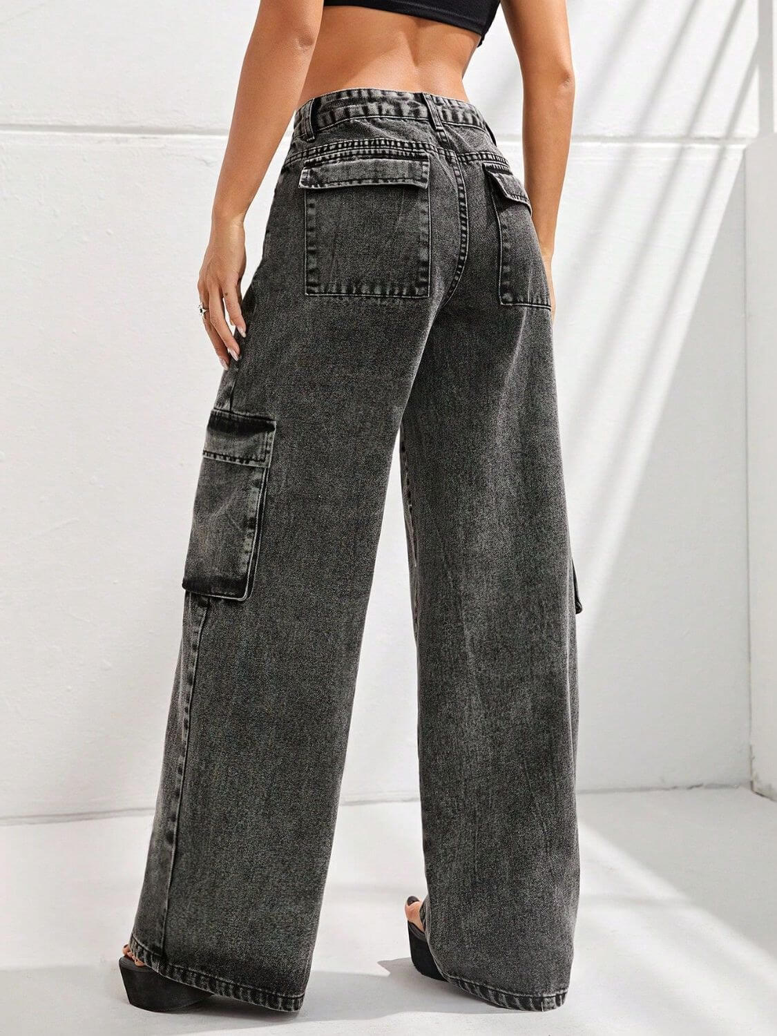 Woman wearing Bella Road Wide Leg Jeans with Pockets featuring a relaxed fit and multiple back pockets.