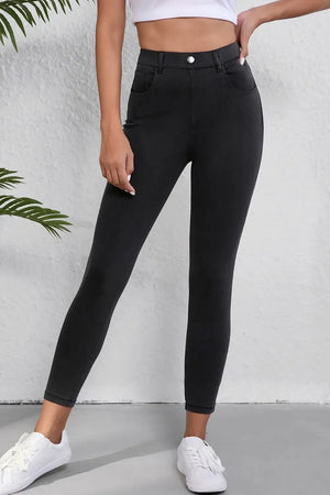 Woman wearing stylish High Waist Jeans with Pockets in black, featuring moderate stretch and a flattering fit suitable for everyday wear.