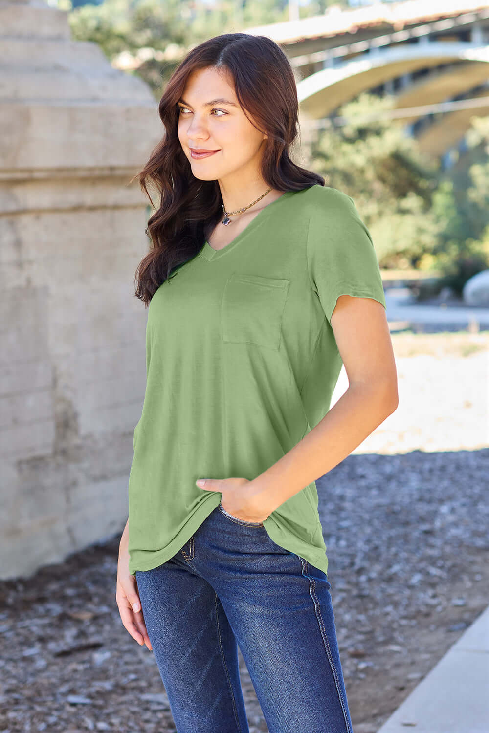 Woman wearing green Basic Bae Bamboo V-Neck Short Sleeve T-Shirt outdoors