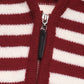 Close-up of burgundy and white striped sweater zipper from Perfee, highlighting cozy knit fabric and stylish design.