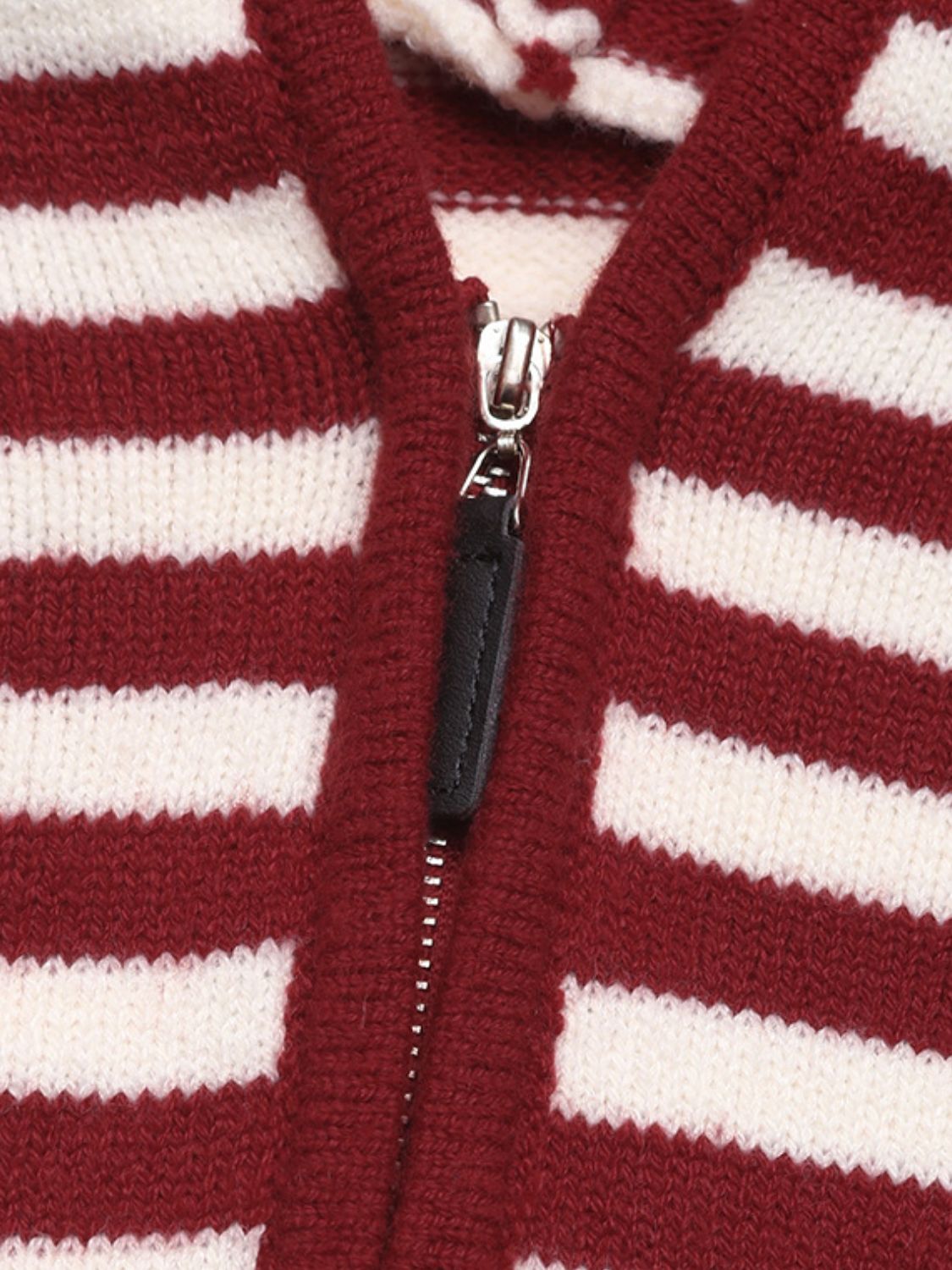 Close-up of burgundy and white striped sweater zipper from Perfee, highlighting cozy knit fabric and stylish design.