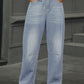 Woman wearing Half Elastic Waist Straight Leg Jeans with pockets, a comfortable and stylish denim option for women.