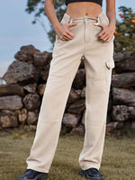 Woman wearing Bella Road High Waist Cargo Straight Jeans in beige standing outdoors.