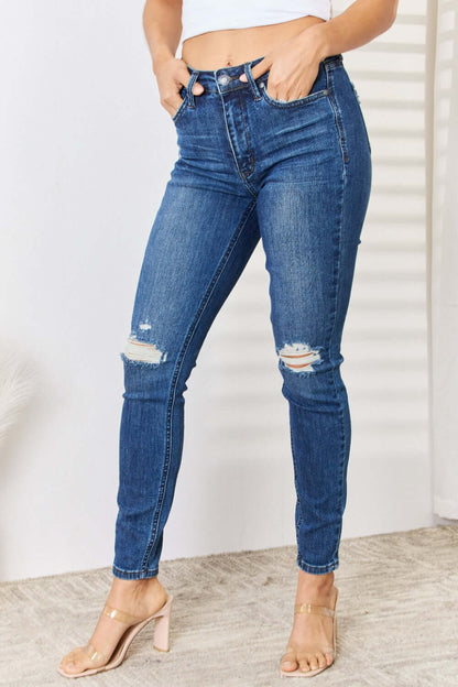 Mid Waist Distressed Slim Judy Blue Jeans full size, featuring a mid-rise waist, slim fit, and edgy distressed detailing. Ideal for casual wear.