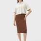 Model showcasing the Millennia Slit Wrap Active Skirt in brown, paired with a stylish cropped shirt and sneakers.