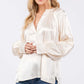 Woman wearing Notched Long Sleeve Blouse, viscose popover blouse with split neckline, raglan sleeves, elegant versatile design, casual or formal.