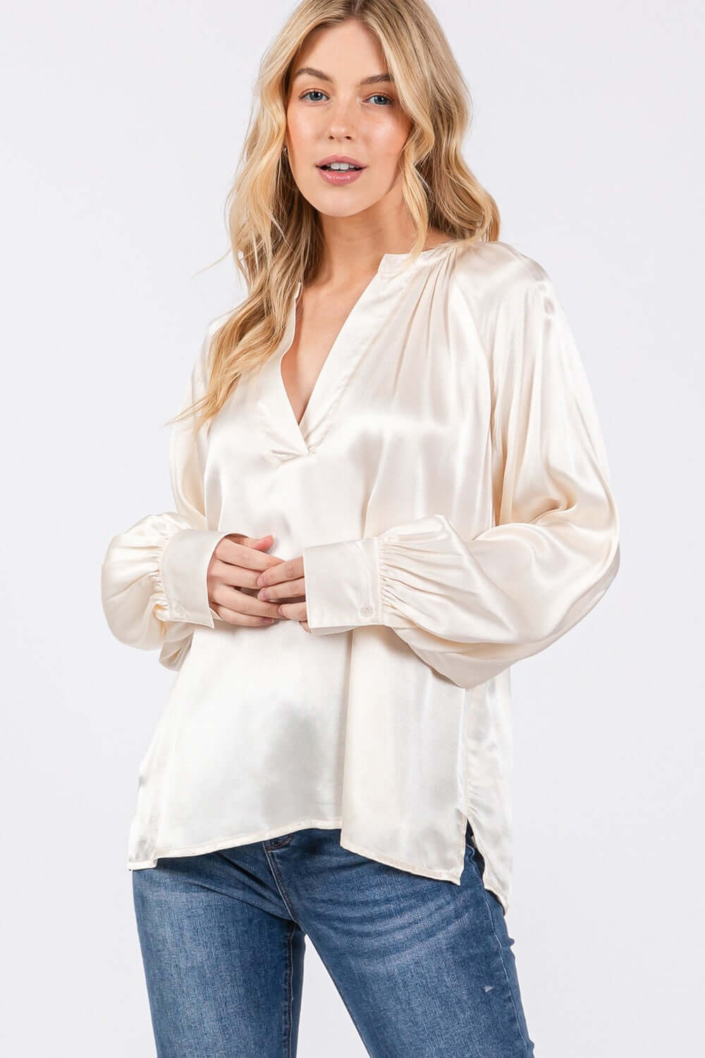 Woman wearing Notched Long Sleeve Blouse, viscose popover blouse with split neckline, raglan sleeves, elegant versatile design, casual or formal.