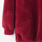 Cozy burgundy teddy hoodie showcasing soft fabric and relaxed cuffs, perfect for chilly days and casual outings.