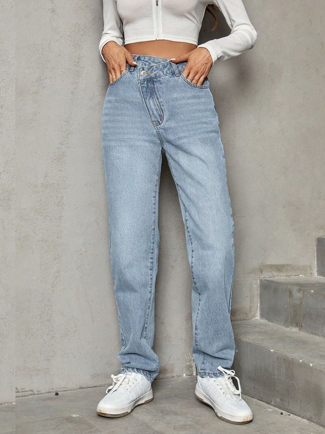 Woman wearing Bella Road Asymmetric Waist Jeans with pockets, stylish and comfortable, featuring a unique design and plush lining.