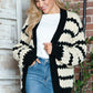 Woman smiles wearing Bella Road Striped Contrast Open Front Long Sleeve Cardigan, ideal for layering and staying cozy.