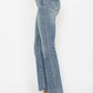 Side view of Judy Blue tummy control bootcut jeans showcasing embroidered pockets and stylish design.