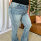 Medium rise tummy control destroy flare jeans with distressed details, highlighting comfort and modern style for a flattering fit.