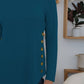 FAM-FAM Round Neck Long Sleeve T-Shirt in teal, featuring decorative side buttons, perfect for casual occasions.