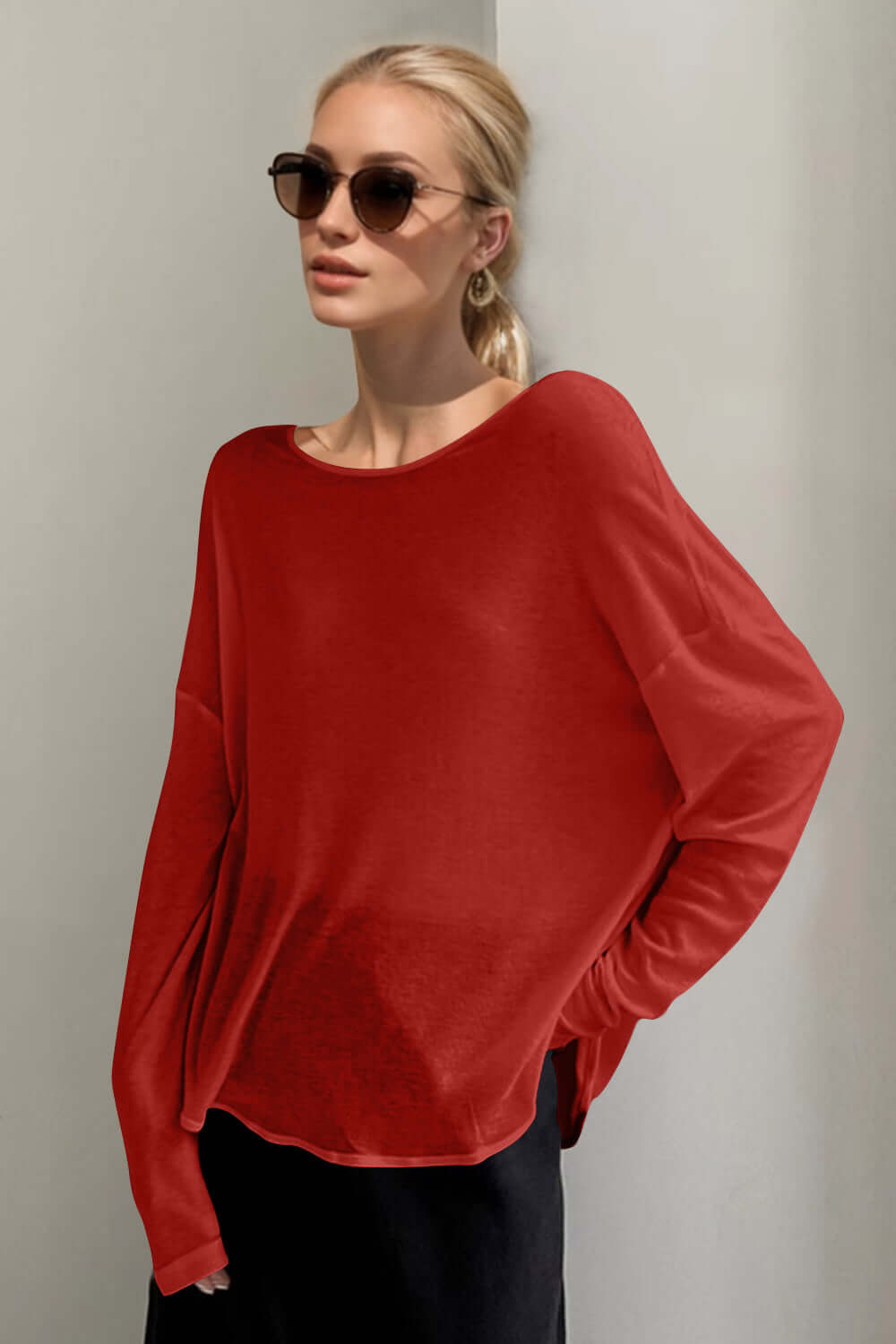 Trendy rust high-low long sleeve T-shirt worn by a stylish person with sunglasses, exuding relaxed and playful vibes.