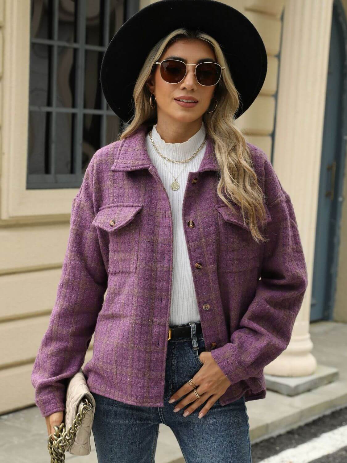 Woman wearing Bella Road Plaid Collared Jacket with long sleeves, sunglasses, hat, and holding a clutch.