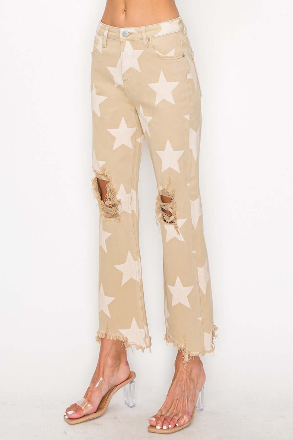 Stylish high-rise star printed jeans with frayed hem, perfect for a trendy and edgy look. Ideal to elevate your fashion.