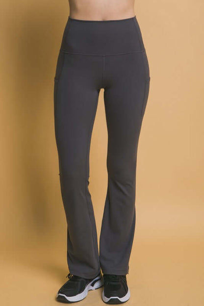 Stylish high waist flare leggings with side pockets, perfect for workouts and daily activities.