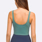 Back view of the Millennia Deep V-Neck Crop Sports Bra in green, highlighting its stylish design and comfortable fit.