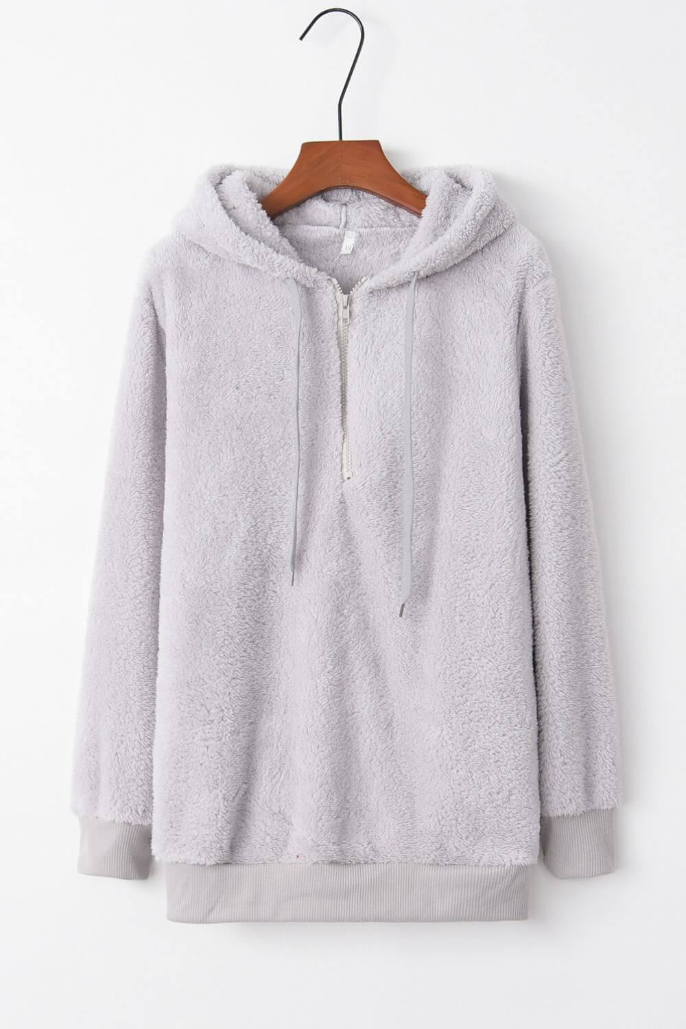 Gray teddy hoodie with quarter-zip and drawstring, perfect for cozy and stylish fashion.