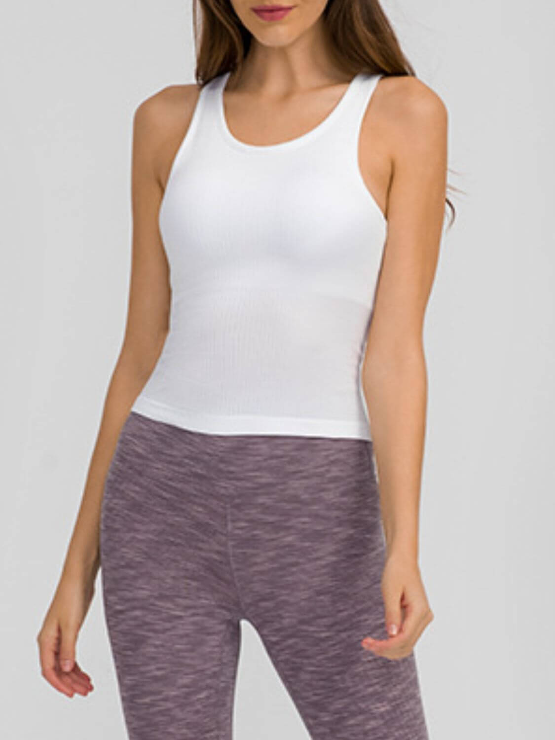 White Millennia Round Neck Racerback Active Tank paired with stylish leggings for active workouts and comfort.