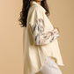 Umgee plus size distressed button-up jacket with raw hem and animal print sleeves, perfect for stylish layering.