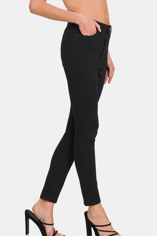 High rise skinny jeans with pockets, showcasing a slim fit and stylish look, perfect for any occasion.