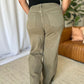 Woman wearing RFM Full Size High Rise Garment Dye Wide Leg Jeans in a stylish relaxed fit.