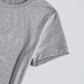 Close-up of a gray graphic round neck short sleeve T-shirt made of slightly stretchy 100% polyester material.