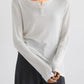 Basic Bae Notched Long Sleeve T-Shirt in white, featuring a unique neckline, perfect for casual or dressy occasions.