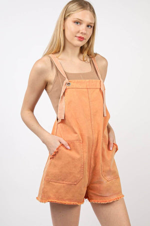 Trendy washed frayed hem orange denim overall romper with side and back pockets, perfect for casual outings and vintage fashion enthusiasts.