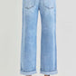 Back view of RISEN Full Size Ankle Wide Leg Cuffed Jeans, showcasing a relaxed fit and stylish cuffed hem.