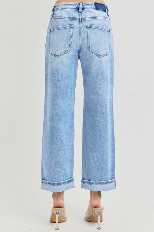 Back view of RISEN Full Size Ankle Wide Leg Cuffed Jeans, showcasing a relaxed fit and stylish cuffed hem.